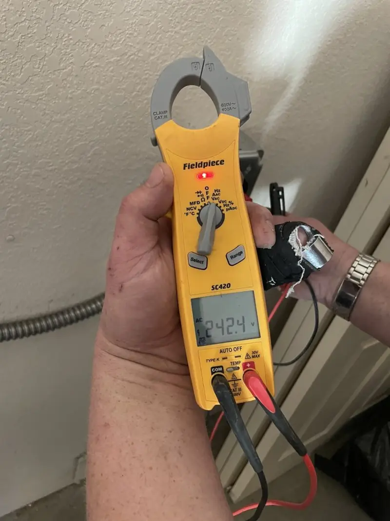 Voltage testing with clamp meter during Electrical Installation Services in Newcastle